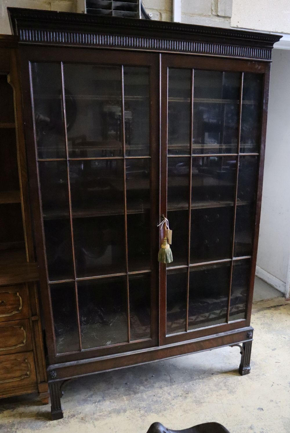 A George III style mahogany bookcase, width 118cm, depth 39cm, height 185cm